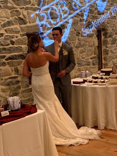 Bride and Groom having fun with cake